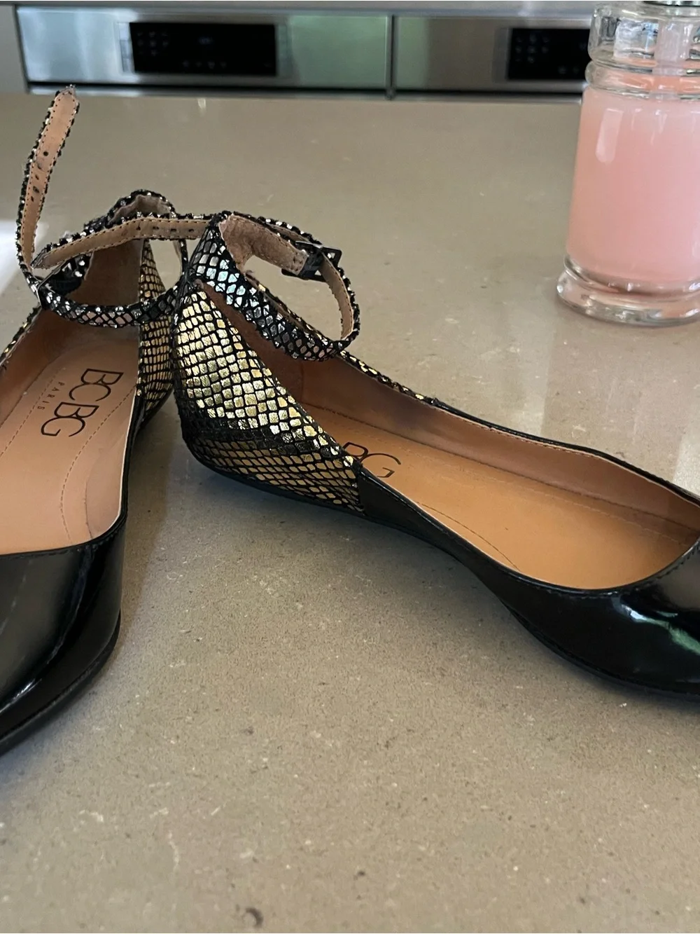 BCBG Black Patent Pointed Toe Flats with Metallic Snakeskin Ankle Strap